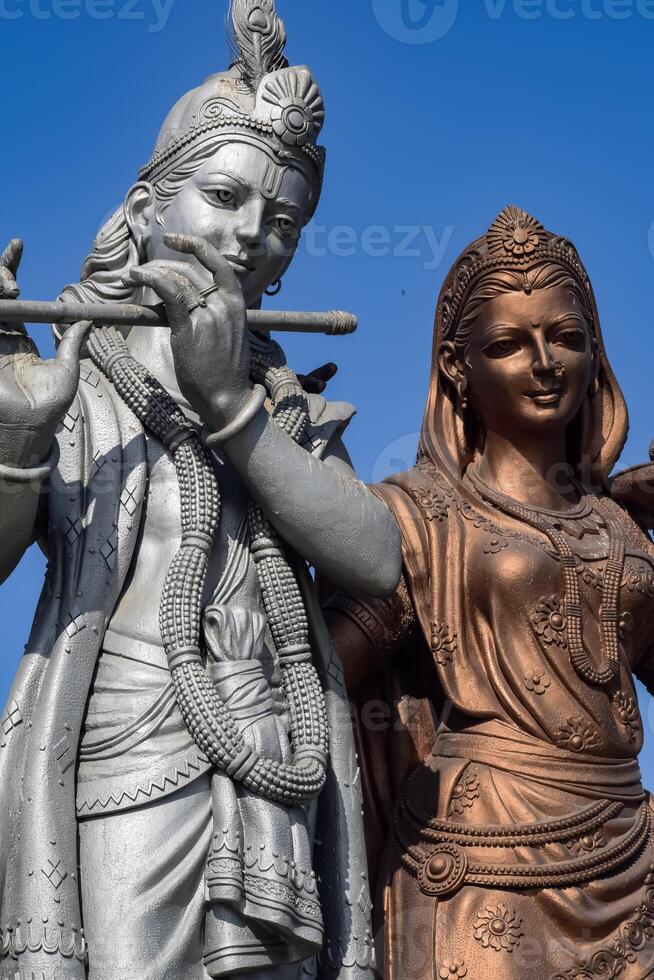 Big statue of Lord Radha Krishna near Delhi International airport, Delhi, India, Lord Krishna and Radha big statue touching sky at main highway Mahipalpur, Delhi photo