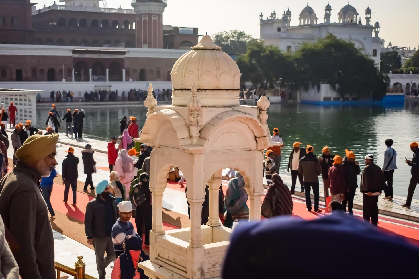 Amritsar, India - February 26 2024 -Unidentified devotees from various parts at Golden Temple - Harmandir Sahib in Amritsar, Punjab, India, Famous indian sikh landmark, Golden Temple photo