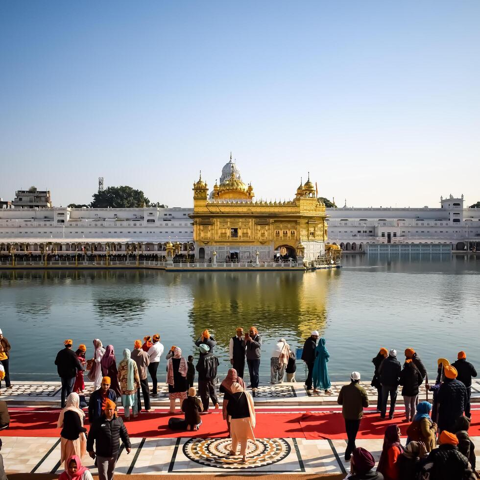 Amritsar, India - February 26 2024 -Unidentified devotees from various parts at Golden Temple - Harmandir Sahib in Amritsar, Punjab, India, Famous indian sikh landmark, Golden Temple photo