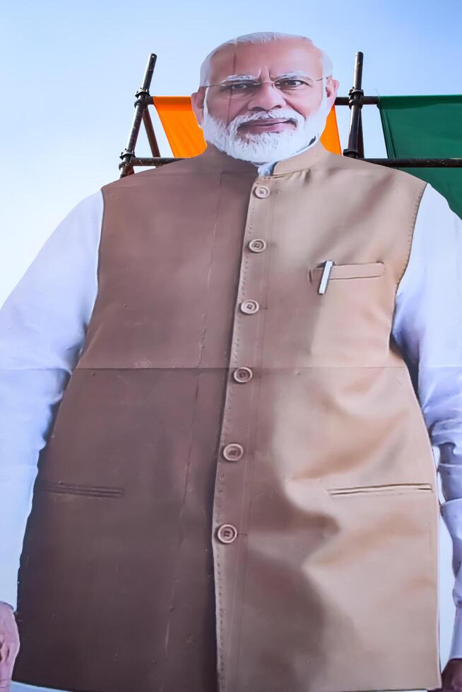 New Delhi, India - February 17 2024 - Prime Minister Narendra Modi cut out during BJP road show, the poster of PM Modi while attending a big election rally in the capital photo