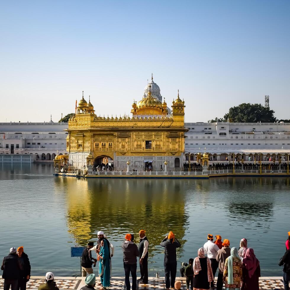Amritsar, India - February 26 2024 -Unidentified devotees from various parts at Golden Temple - Harmandir Sahib in Amritsar, Punjab, India, Famous indian sikh landmark, Golden Temple photo