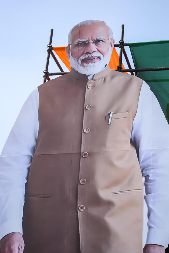 New Delhi, India - February 17 2024 - Prime Minister Narendra Modi cut out during BJP road show, the poster of PM Modi while attending a big election rally in the capital photo