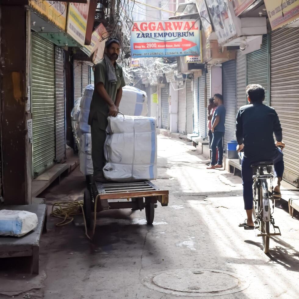 Old Delhi, India, March 15, 2024 - Unidentified men in the streets of Old Delhi, Street Photography of Chandni Chowk market of Old Delhi during morning time, Old Delhi Street Photography photo