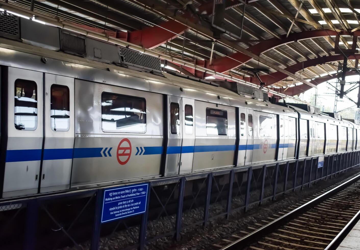 New Delhi, India, February 17 2024 - Delhi Metro train arriving at Jhandewalan metro station in New Delhi, India, Asia, Public Metro departing from Jhandewalan station photo