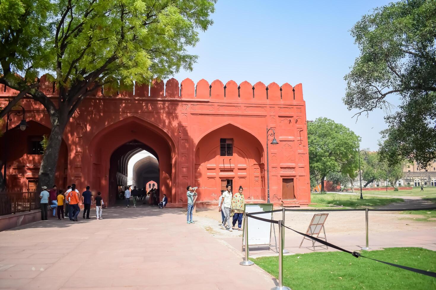 New Delhi, India - April 15 2024 - Unidentified tourists at Red Fort situated in Old Delhi, India, View inside Delhi Red Fort the famous Indian landmarks photo