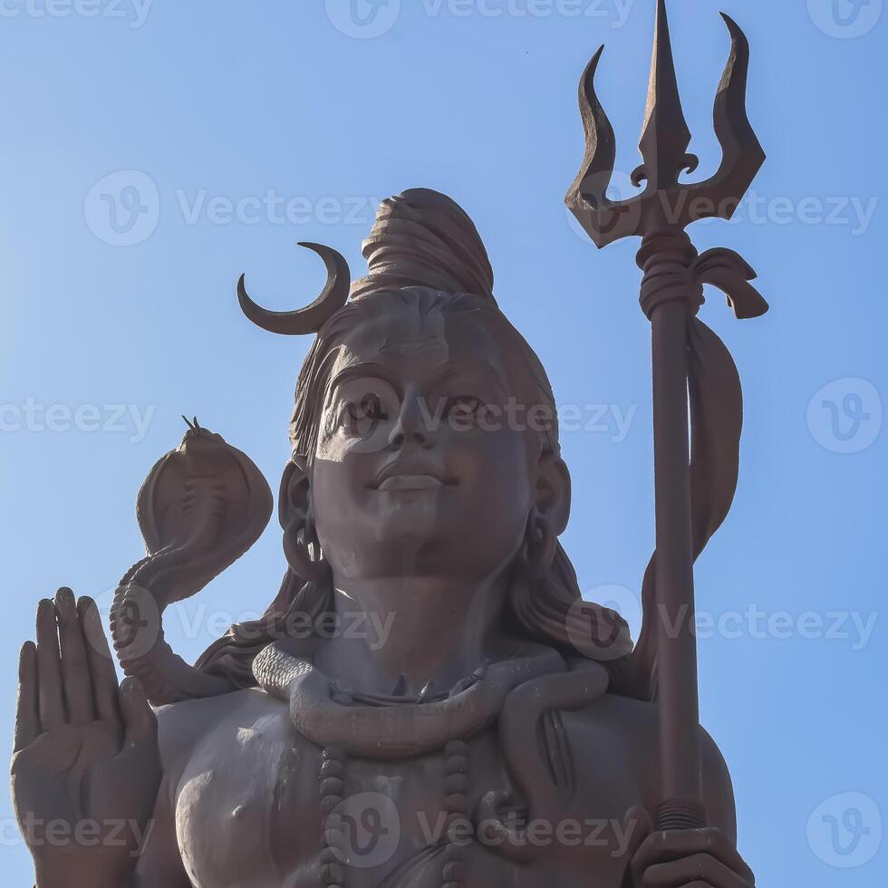 Big statue of Lord Shiva near Delhi International airport, Delhi, India, Lord Shiv big statue touching sky at main highway Mahipalpur, Delhi photo