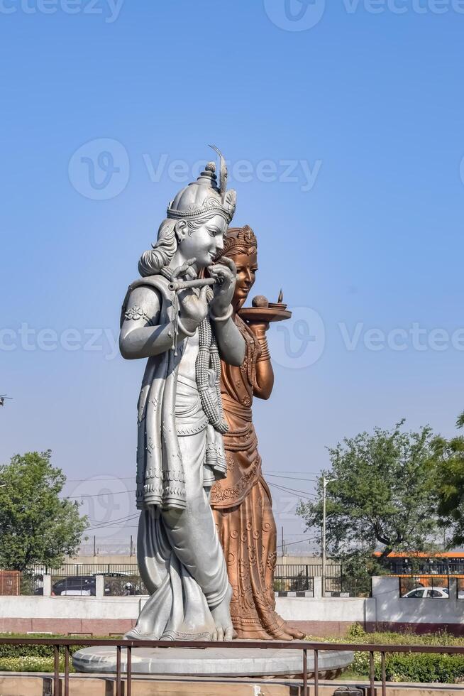 Big statue of Lord Radha Krishna near Delhi International airport, Delhi, India, Lord Krishna and Radha big statue touching sky at main highway Mahipalpur, Delhi photo