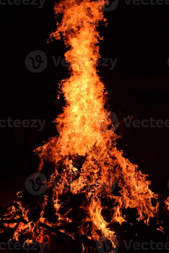 Fire flames on black background, Blaze fire flame texture background, Beautifully, the fire is burning, Fire flames with wood and cow dung bonfire photo
