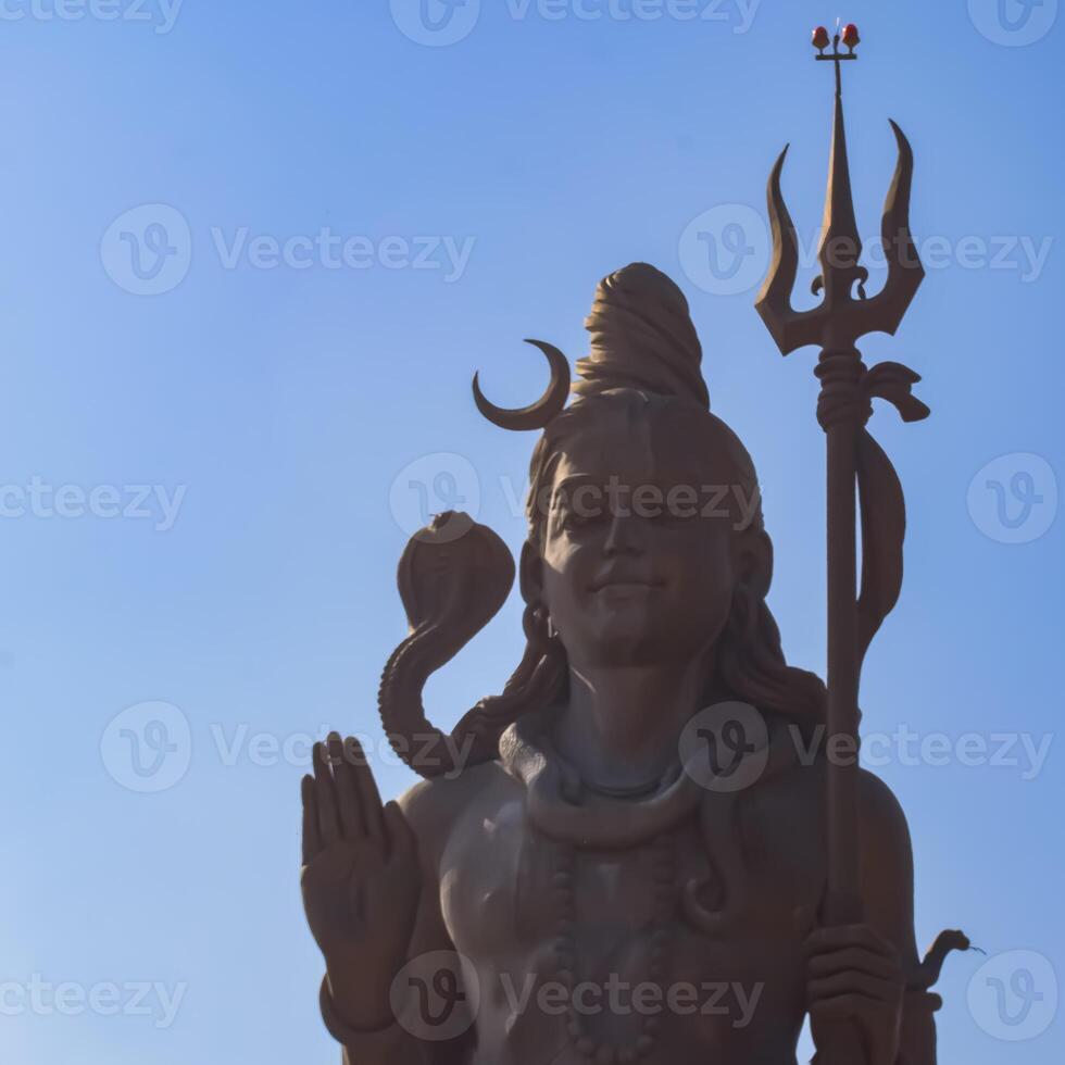 Big statue of Lord Shiva near Delhi International airport, Delhi, India, Lord Shiv big statue touching sky at main highway Mahipalpur, Delhi photo