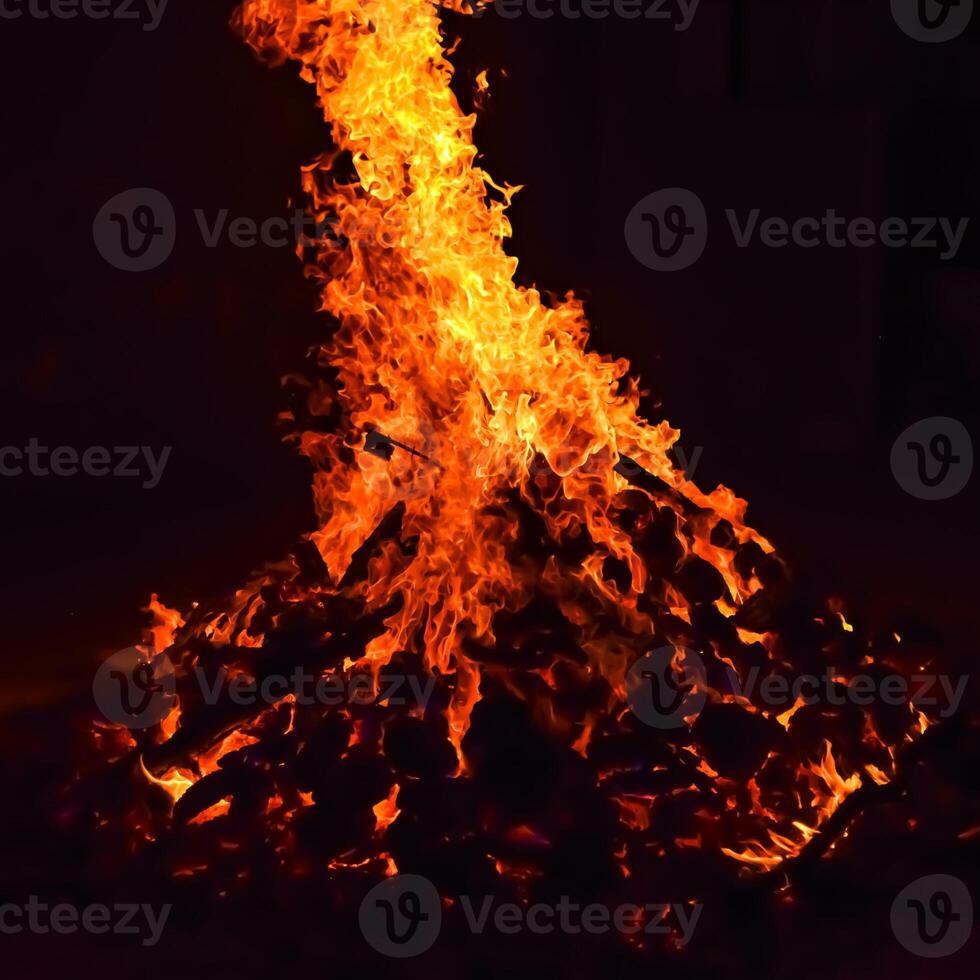 Fire flames on black background, Blaze fire flame texture background, Beautifully, the fire is burning, Fire flames with wood and cow dung bonfire photo