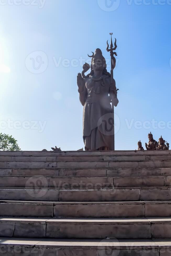 Big statue of Lord Shiva near Delhi International airport, Delhi, India, Lord Shiv big statue touching sky at main highway Mahipalpur, Delhi photo