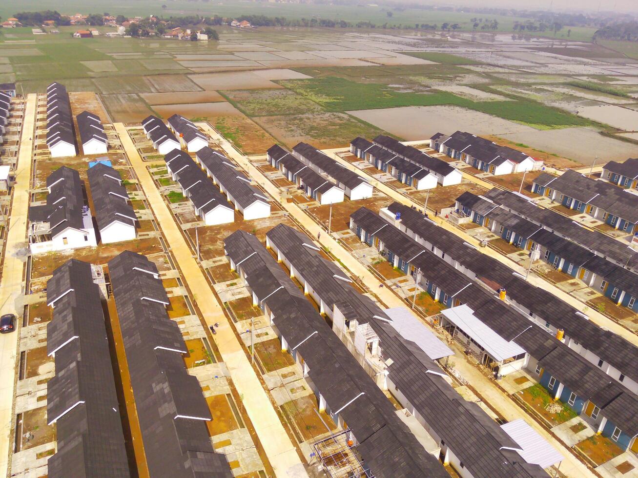 Housing Development in Bandung City - Indonesia. Aerial drone view of public housing on the edge of the city. View from above, Housing Development. Above. Social issues. Shot from drone flying photo