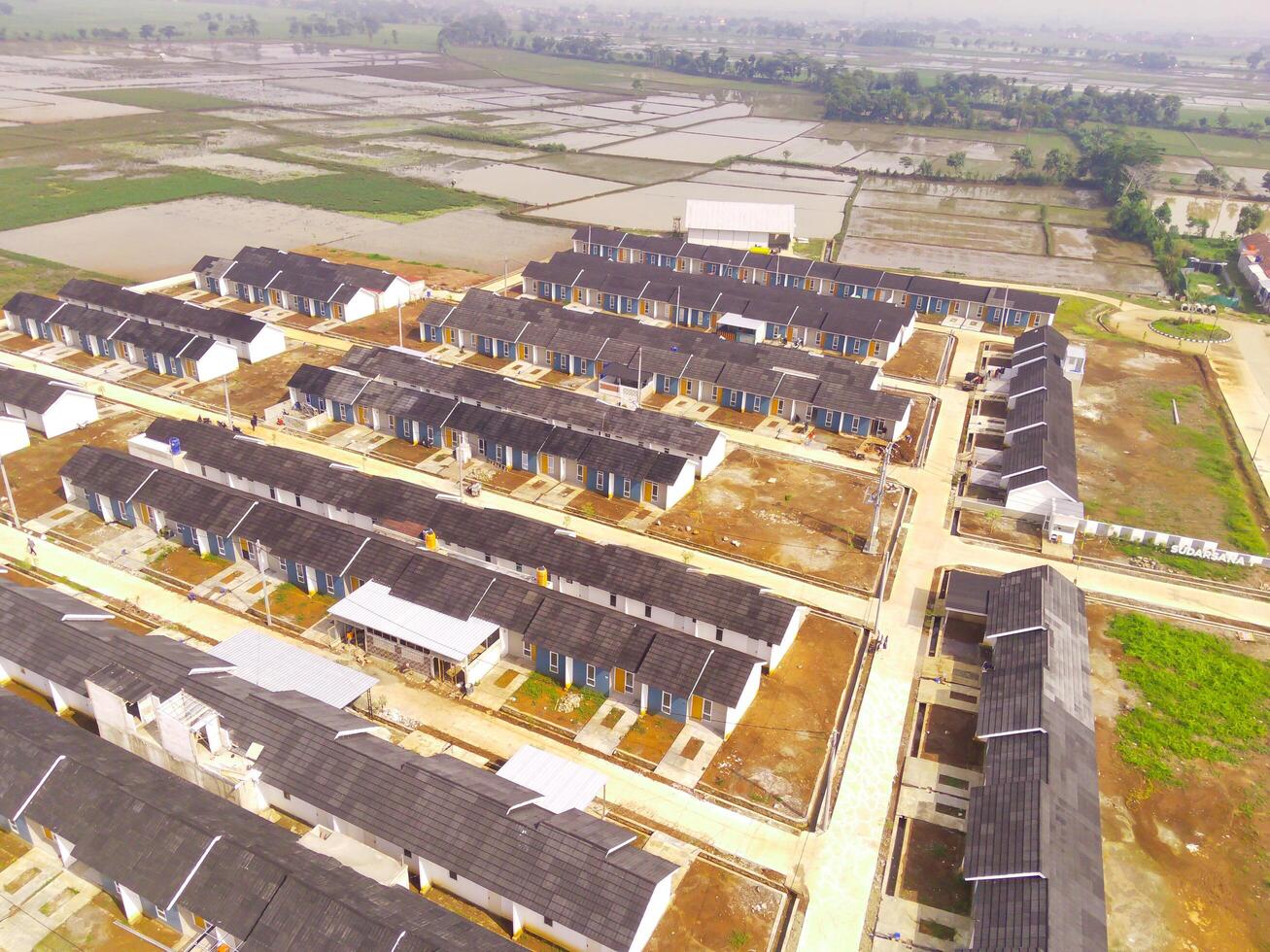 Housing Development in Bandung City - Indonesia. Aerial drone view of public housing on the edge of the city. View from above, Housing Development. Above. Social issues. Shot from drone flying photo