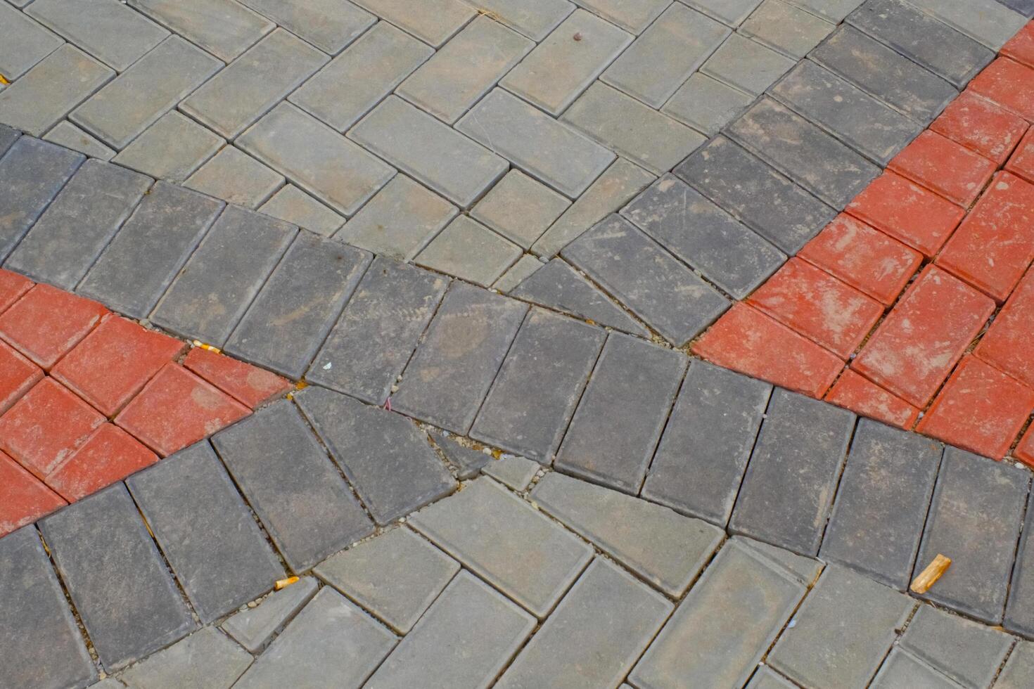 Background Photography. Textured Backgrounds. Detail of road texture with paving blocks. Square paving blocks painted in gray and red. Bandung, Indonesia photo