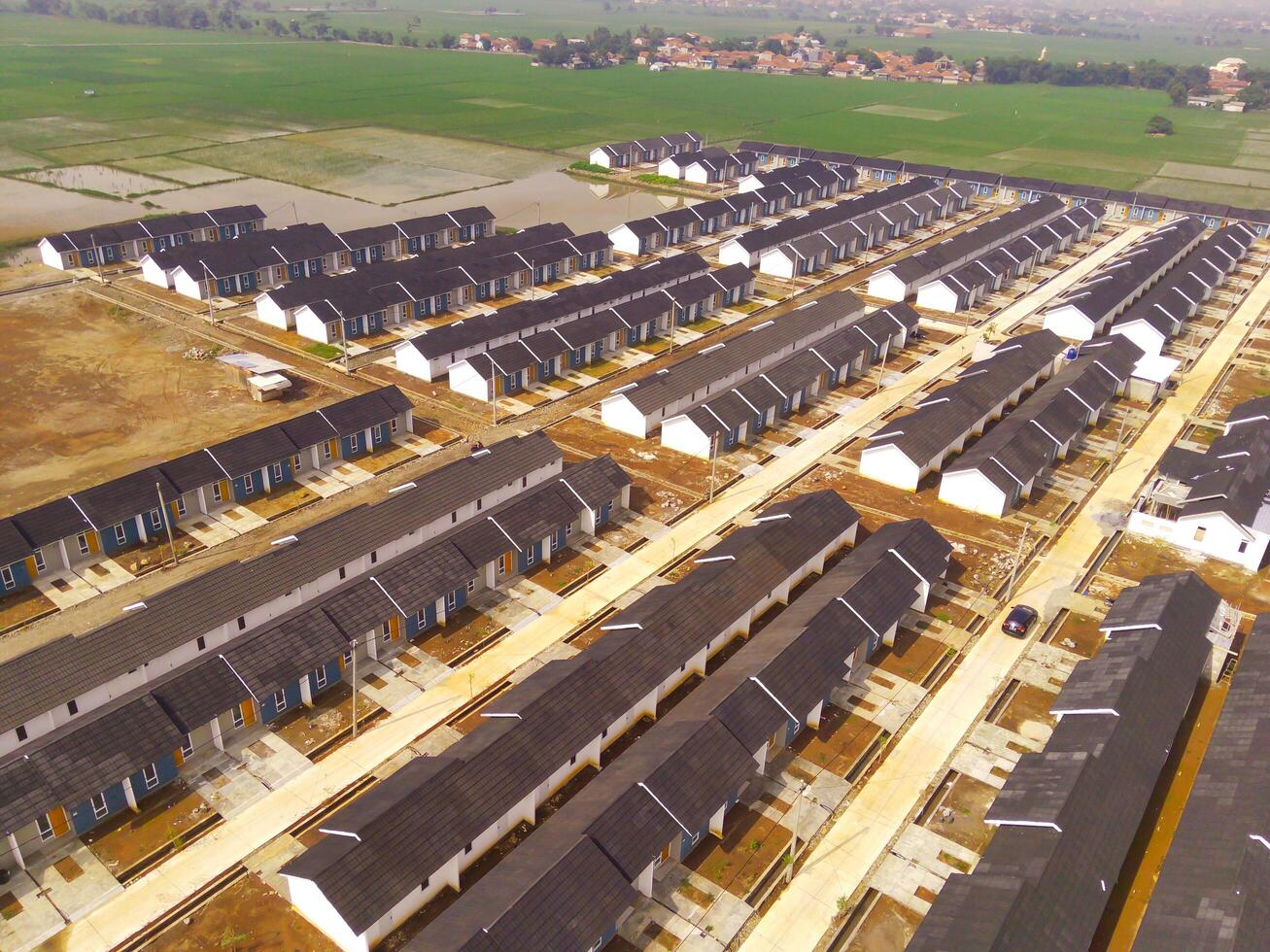 Housing Development in Bandung City - Indonesia. Aerial drone view of public housing on the edge of the city. View from above, Housing Development. Above. Social issues. Shot from drone flying photo