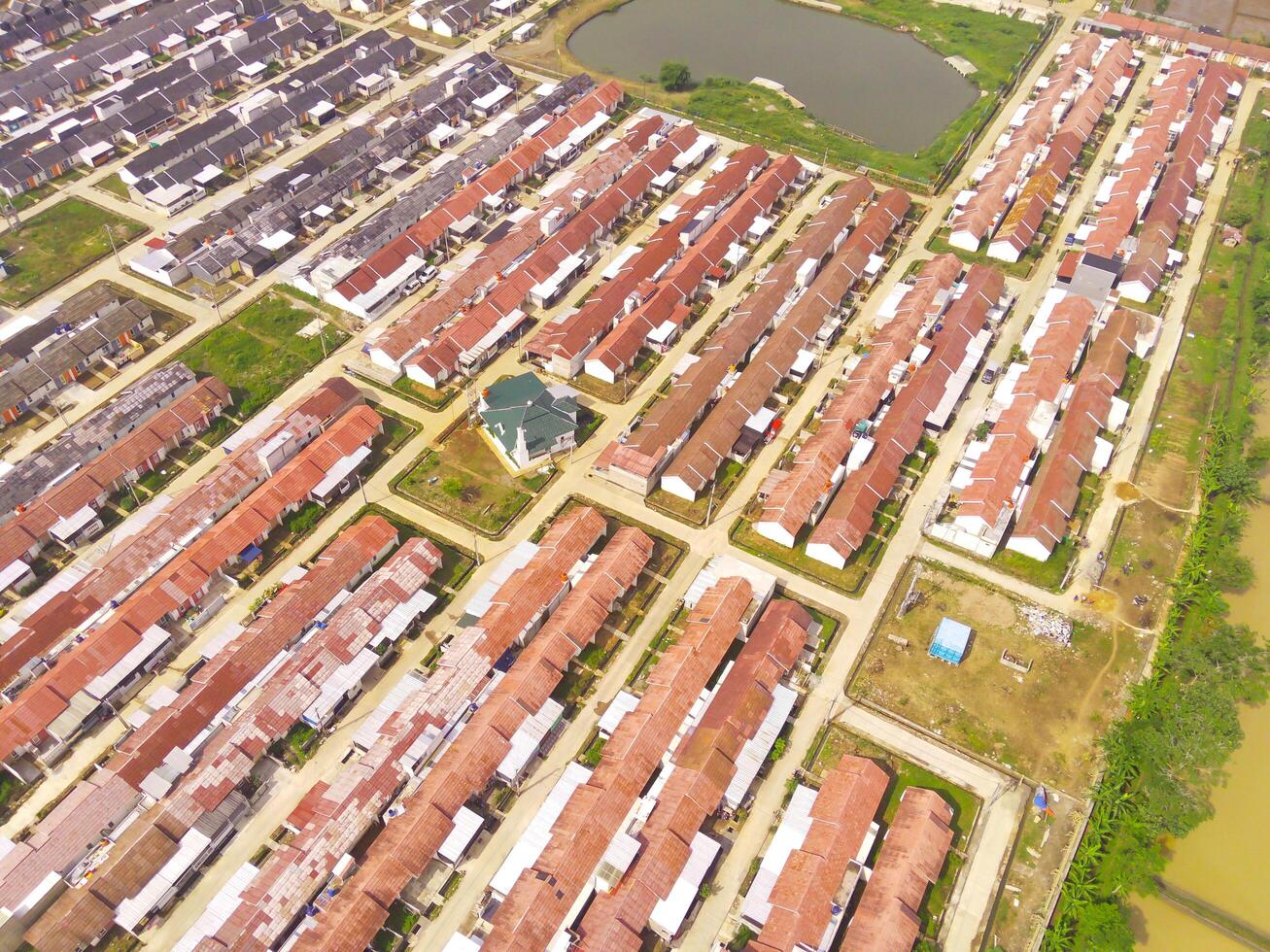 Housing Development in Bandung City - Indonesia. Aerial drone view of public housing on the edge of the city. View from above, Housing Development. Above. Social issues. Shot from drone flying photo