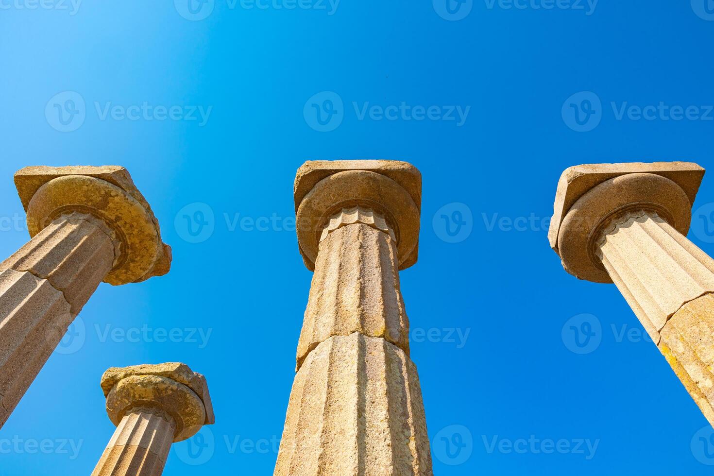 Ancient greek architecture background photo. Columns of the Temple of Athena photo