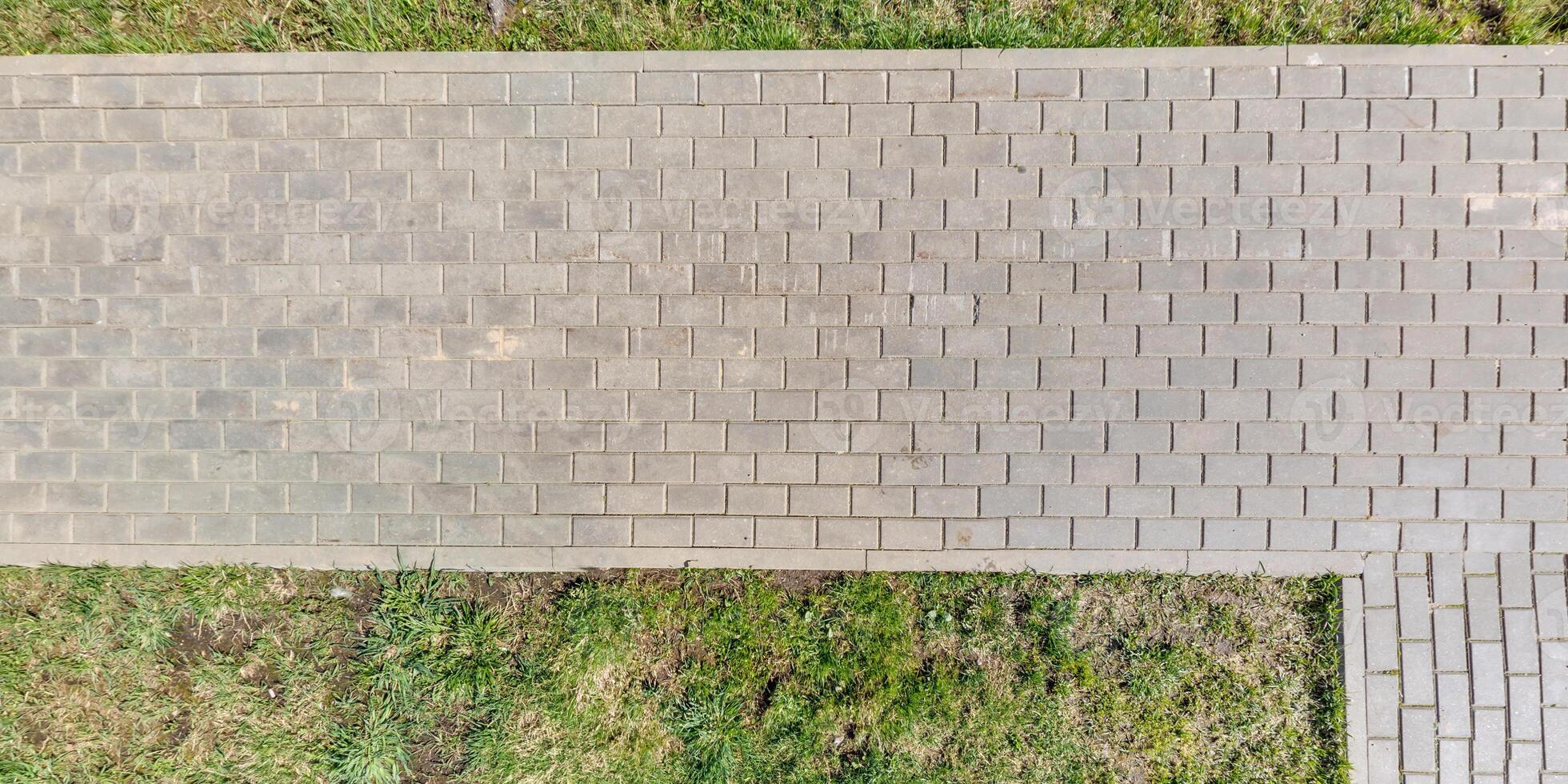 top view of the texture of paving slabs on pedestrian path photo