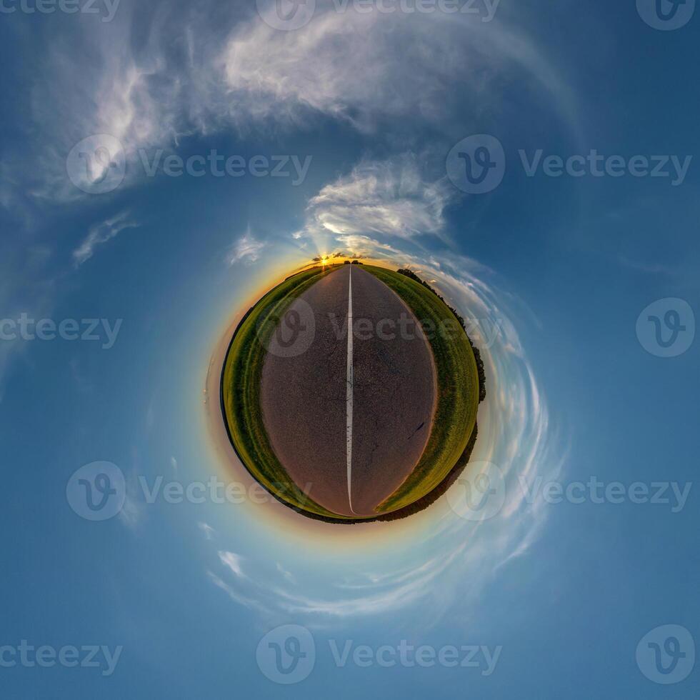 simple tiny planet without buildings in blue sky with beautiful clouds. Transformation of spherical panorama 360 degrees. Spherical abstract aerial view. Curvature of space. photo