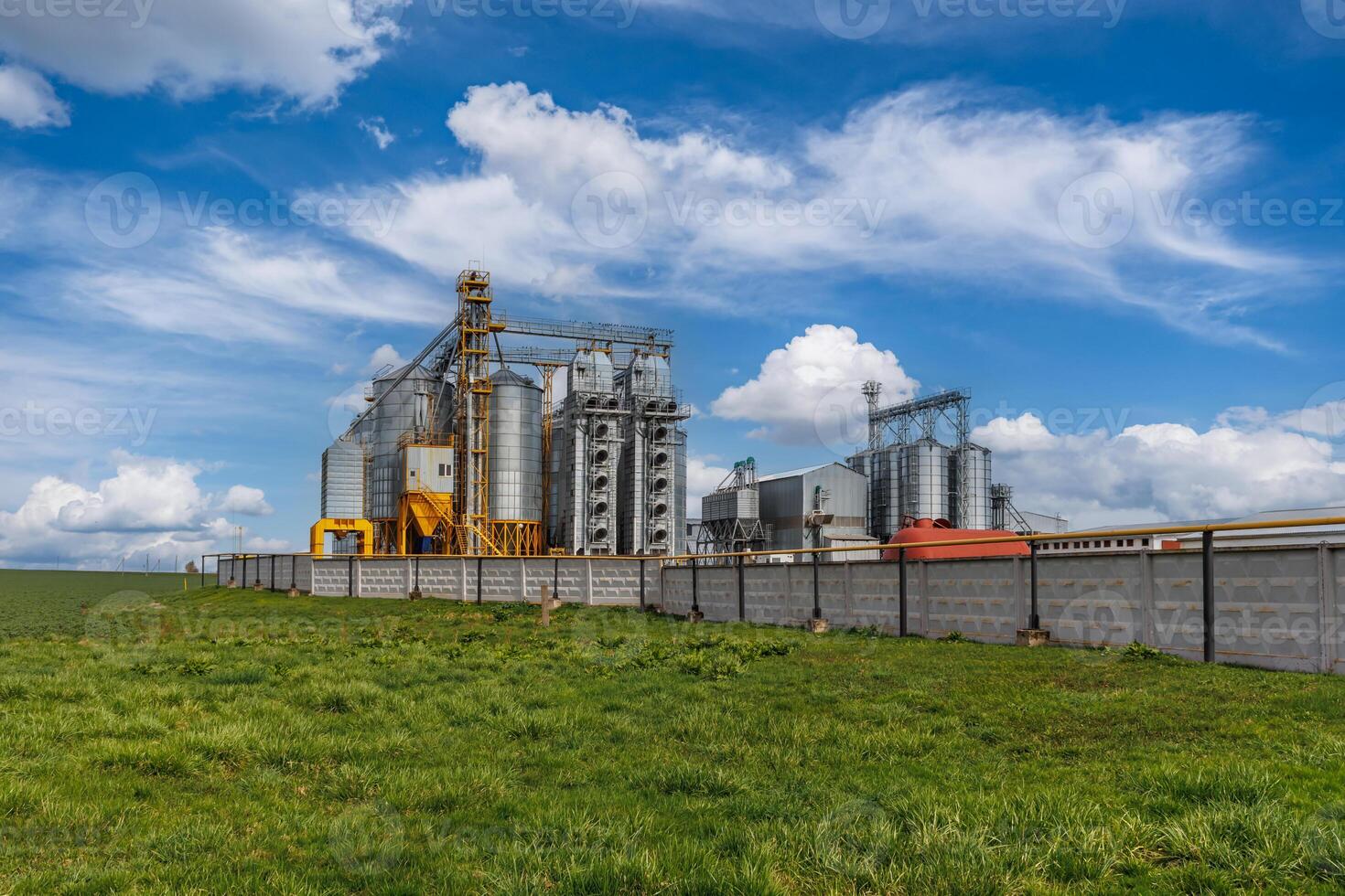 silos on agro-industrial complex with seed cleaning and drying line for grain storage photo