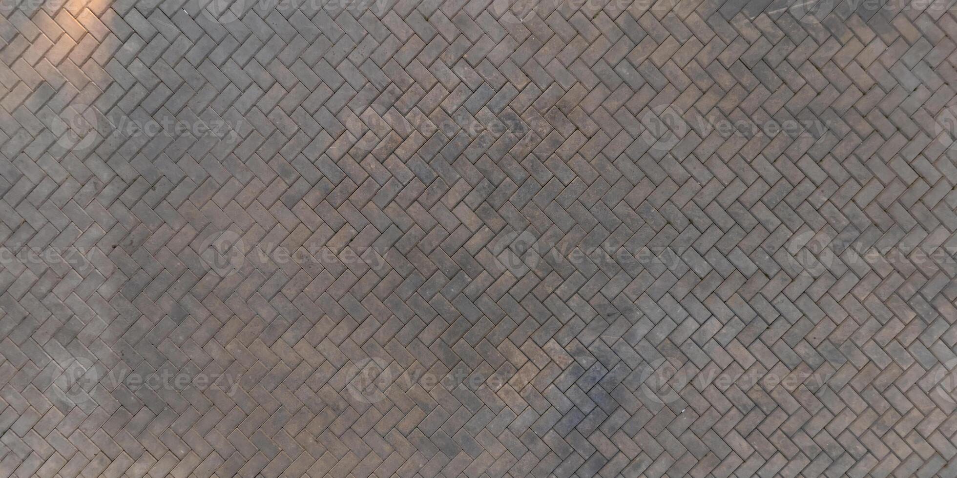 top view of the texture of paving slabs on pedestrian path photo