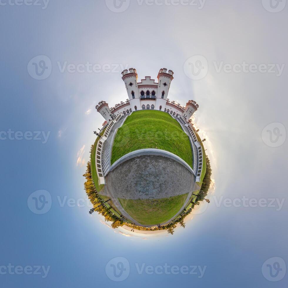 little planet and spherical aerial 360 panorama view on street ancient medieval castle with church and historic buildings with columns photo