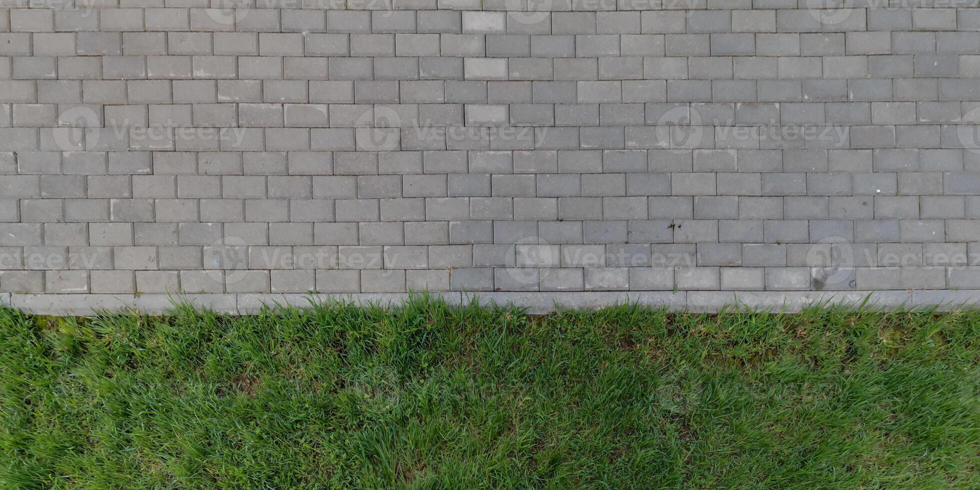 top view of the texture of paving slabs on pedestrian path photo