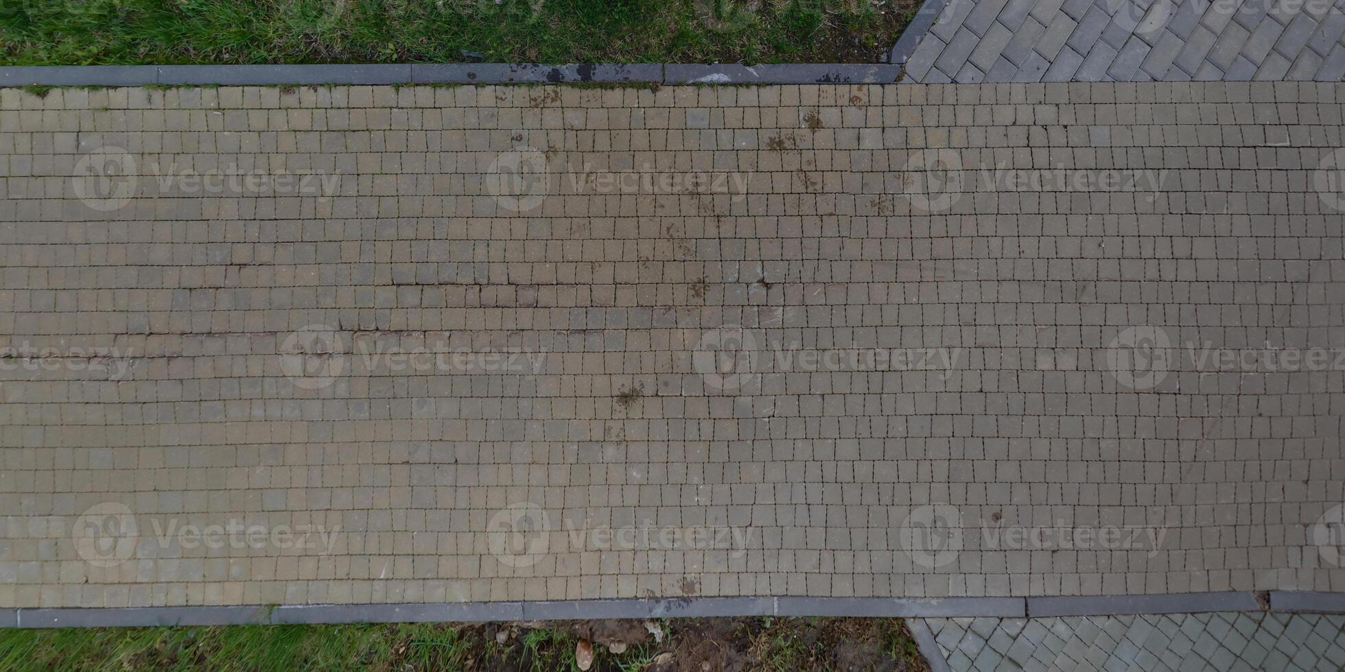 top view of the texture of paving slabs on pedestrian path photo