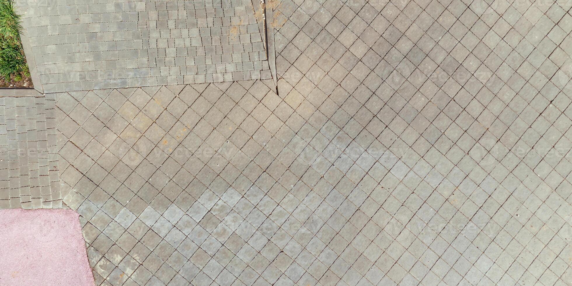 top view of the texture of paving slabs on pedestrian path photo