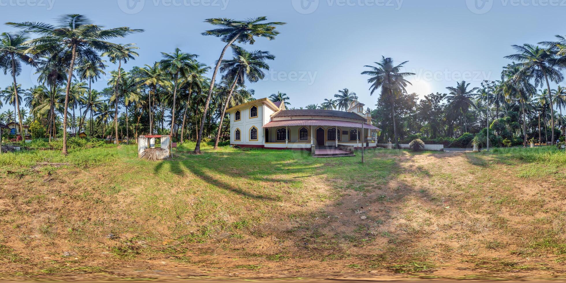 full hdri 360 panorama of portugal catholic church in jungle among palm trees in Indian tropic village in equirectangular projection with zenith and nadir. VR AR content photo
