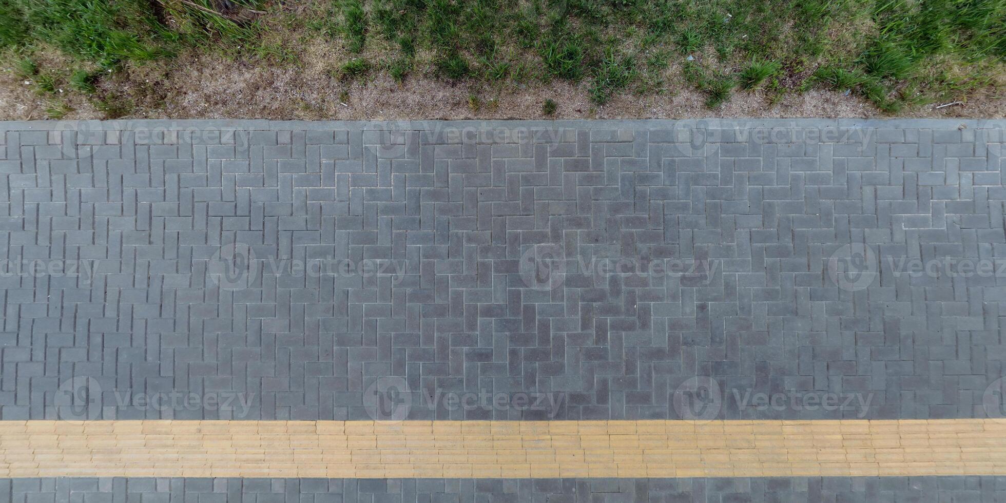 top view of the texture of paving slabs on pedestrian path photo