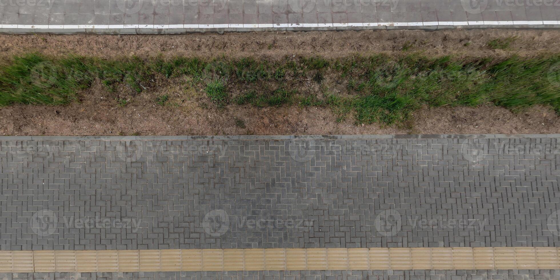 top view of the texture of paving slabs on pedestrian path photo