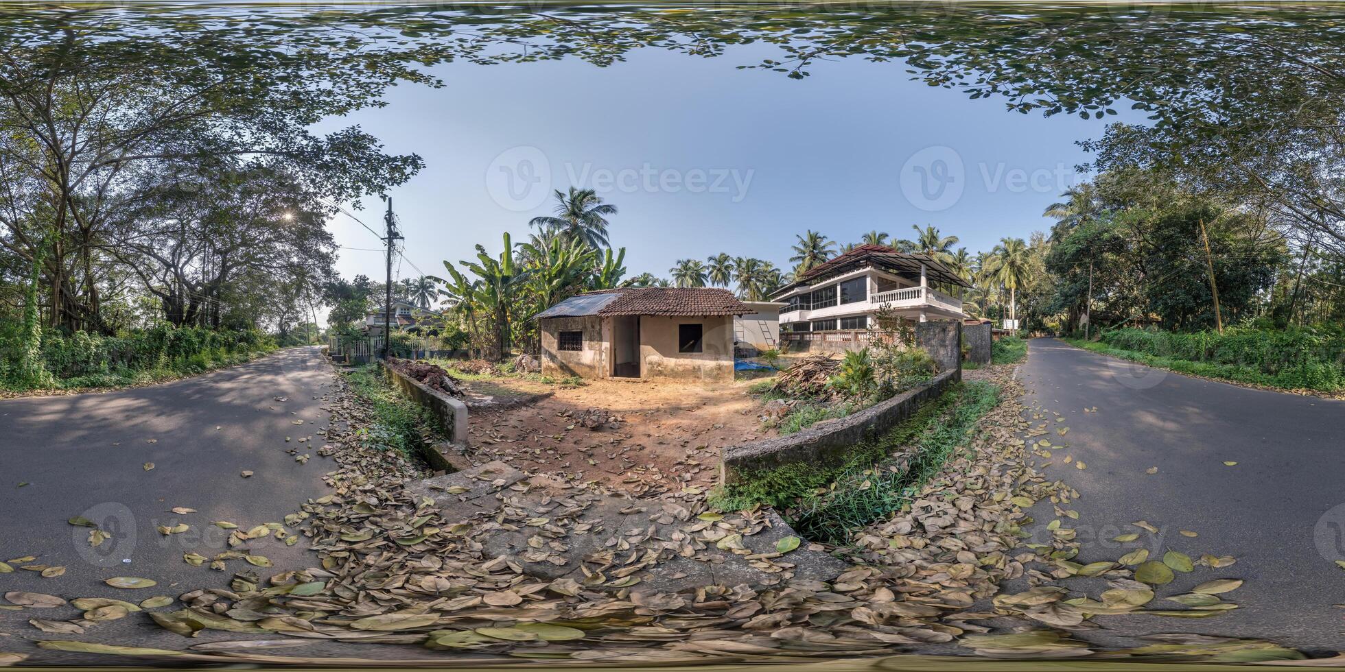 full seamless spherical hdr 360 panorama view among green street with cottages, villas and coconut trees in an indian tropic village in equirectangular projection, ready for VR AR virtual reality photo