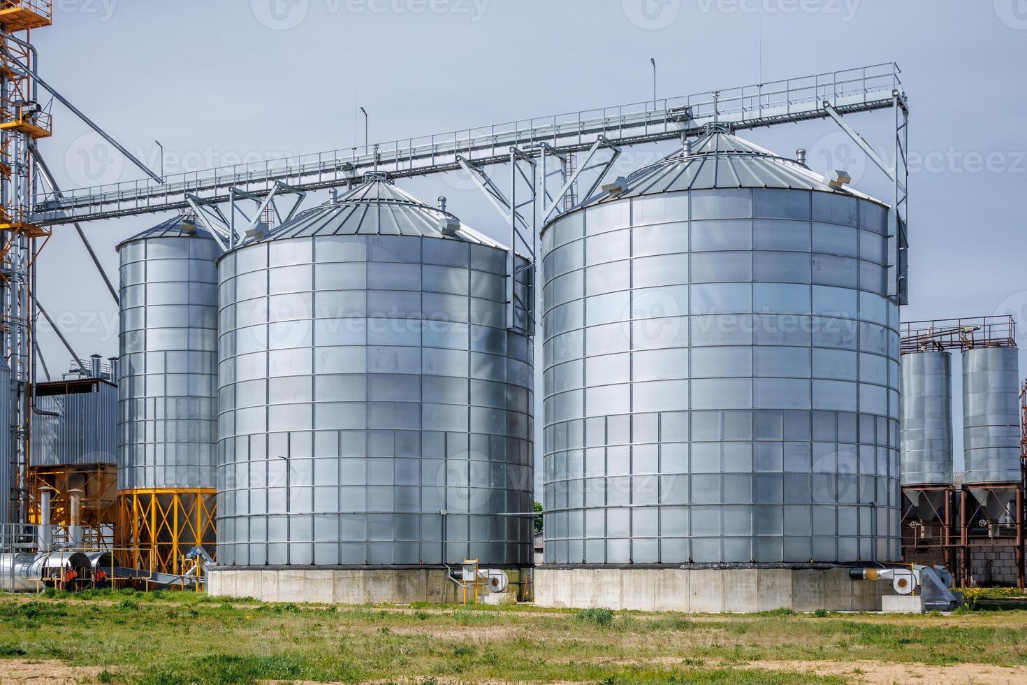 silos granary elevator on agro-industrial complex with seed cleaning and drying line for grain storage photo