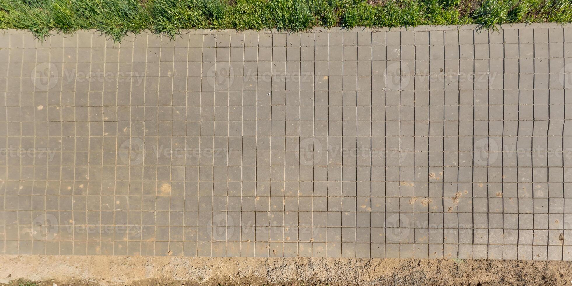 top view of the texture of paving slabs on pedestrian path photo