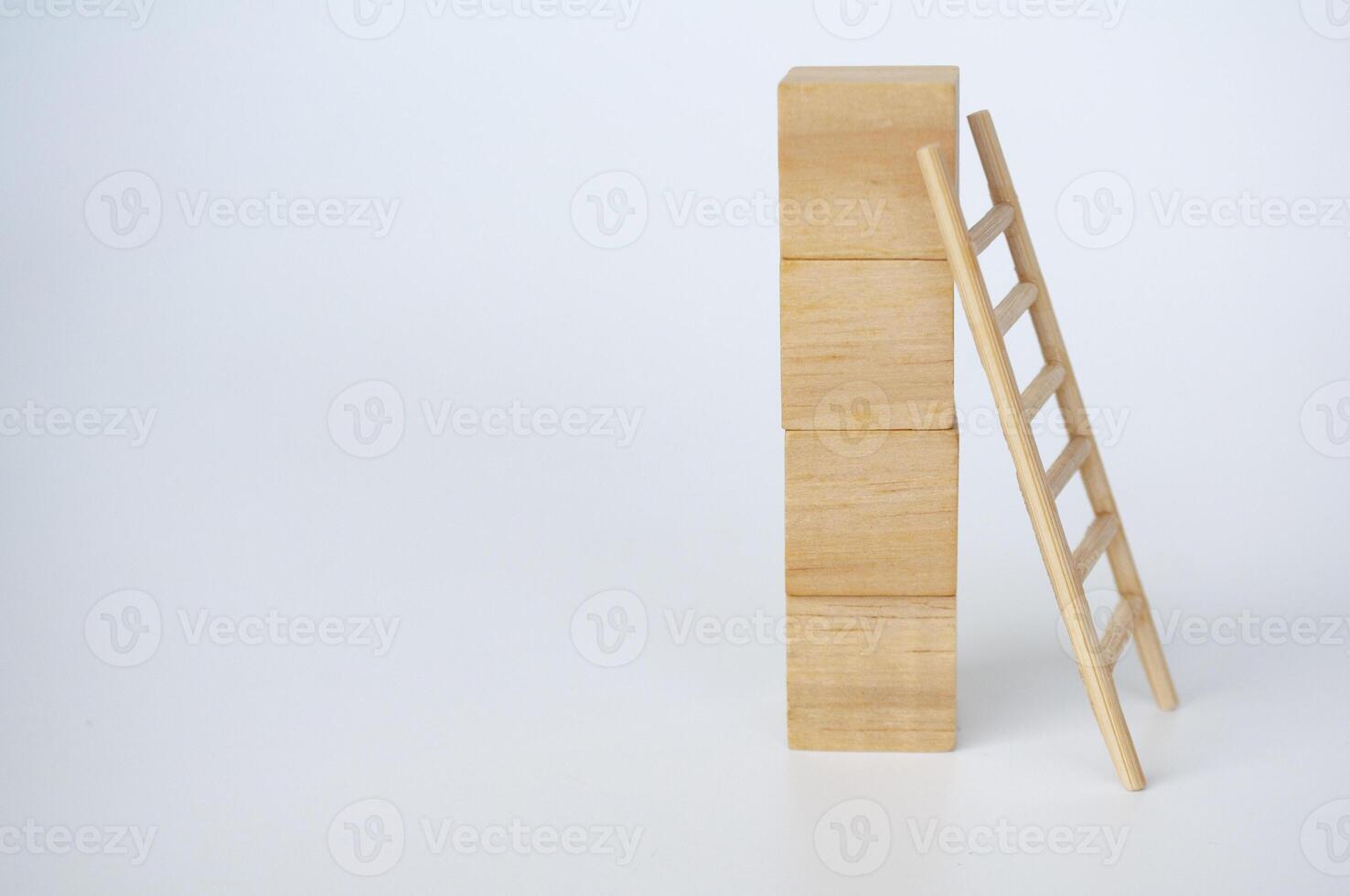 Wooden cubes with ladder on white background with customizable space for text photo