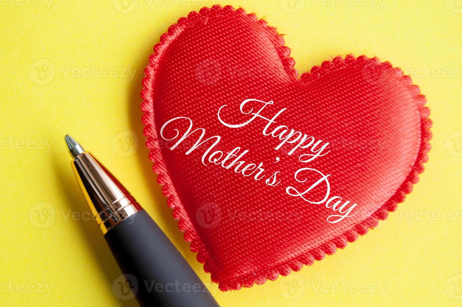 Top view of happy mother's day on red heart shape on yellow background. Happy Mother's Day Concept photo