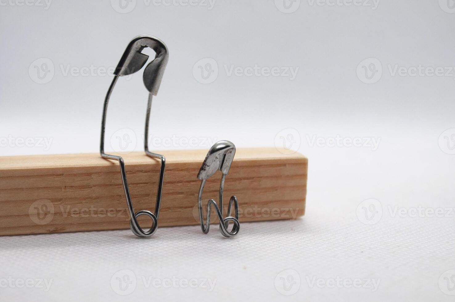 Model safety pin of mother or farther comforting his of her son. Family concept photo