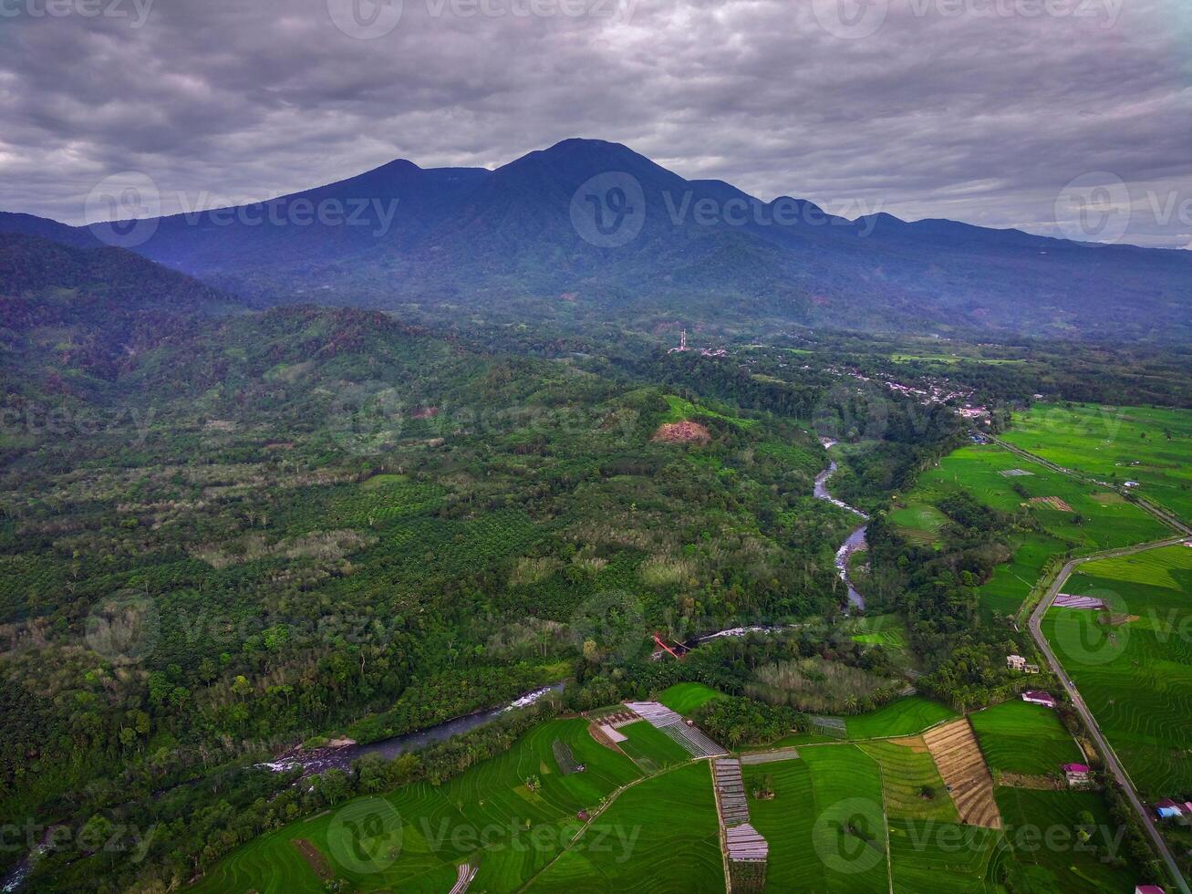 beautiful morning view from Indonesia of mountains and tropical forest photo