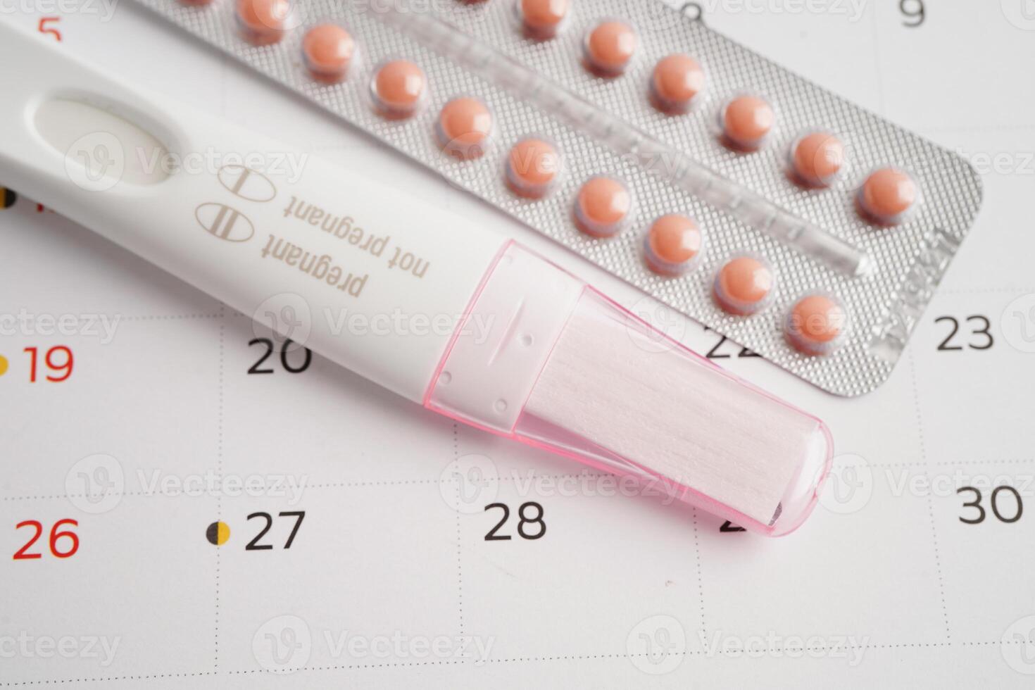 Pregnancy test with birth control pills for female of ovulation day, fetus, maternity, childbirth. photo