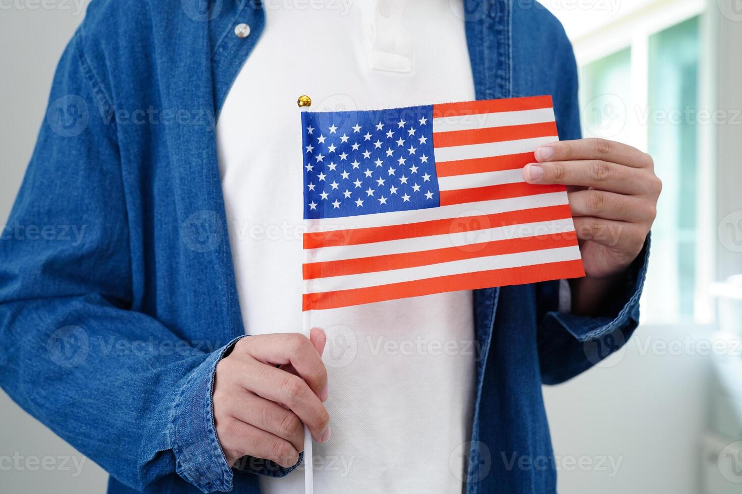 Learning English, Asian teenage student holding flag for language program education. photo