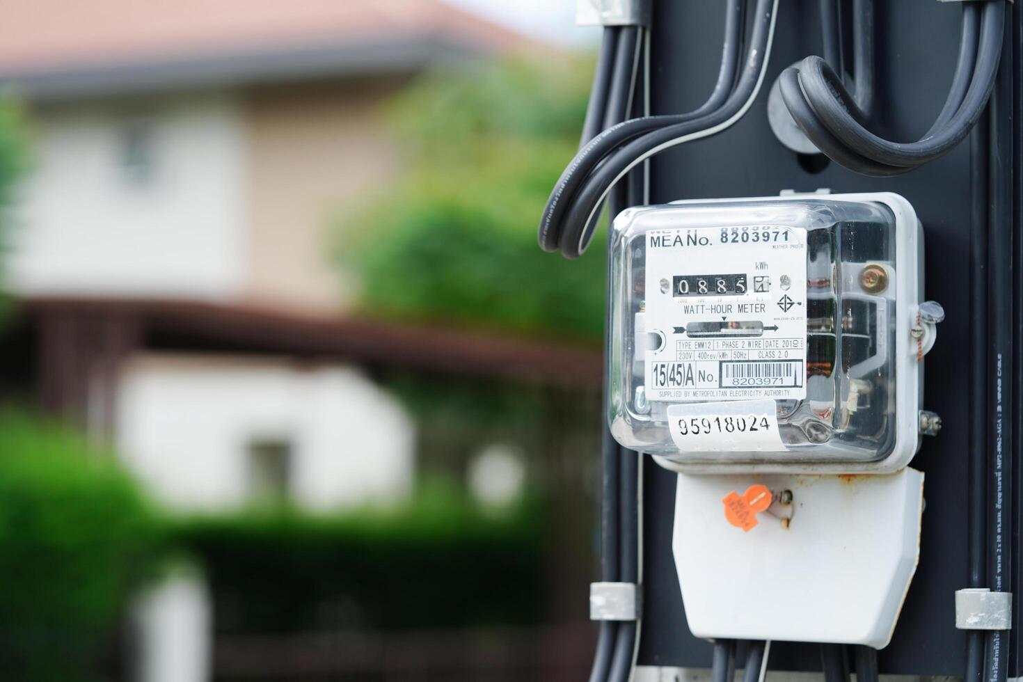 Bangkok, Thailand - May 15, 2022 Electric measuring power meter for energy cost at home and office. photo