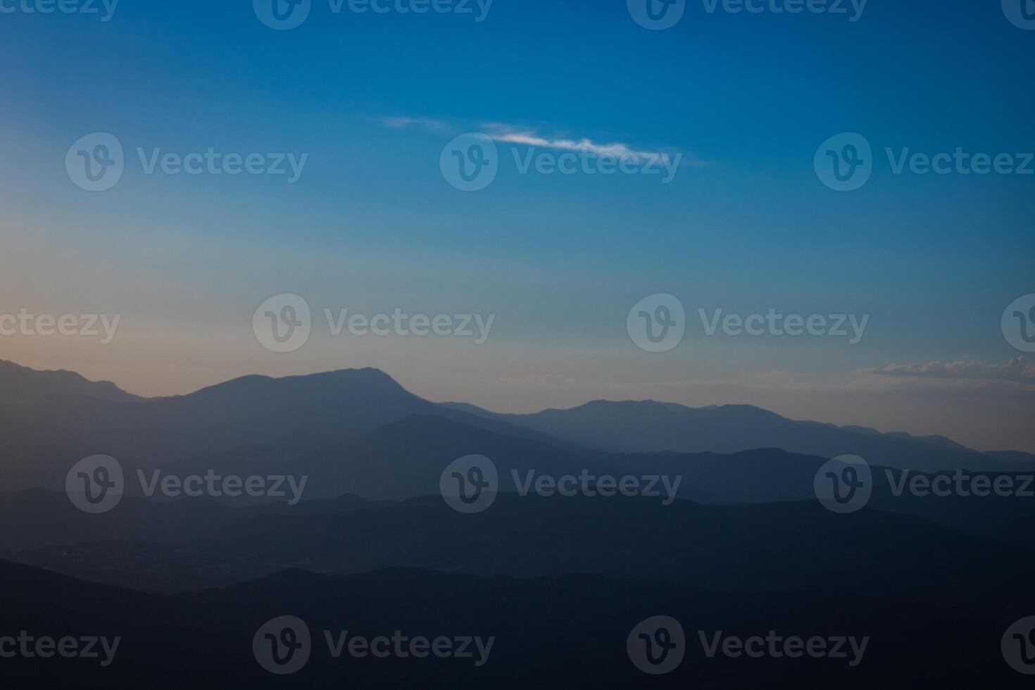 Layered silhouette of hills at sunset from Mount Nemrut photo