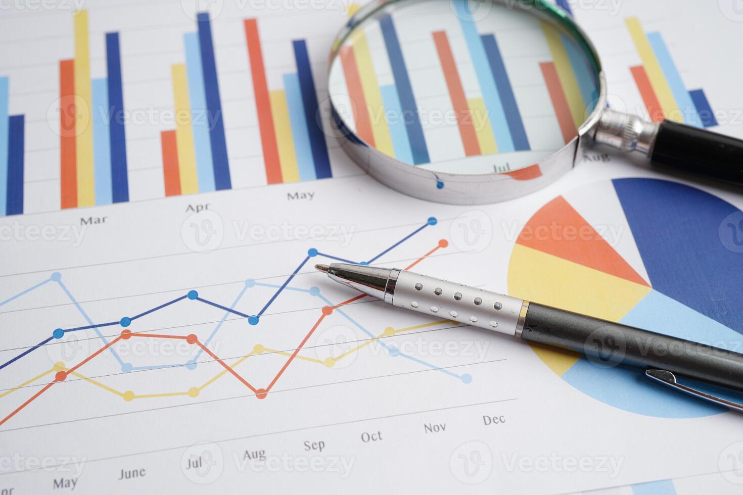 Magnifying glass on charts graphs paper. Financial development, Banking Account, Statistics, Investment Analytic research data economy. photo