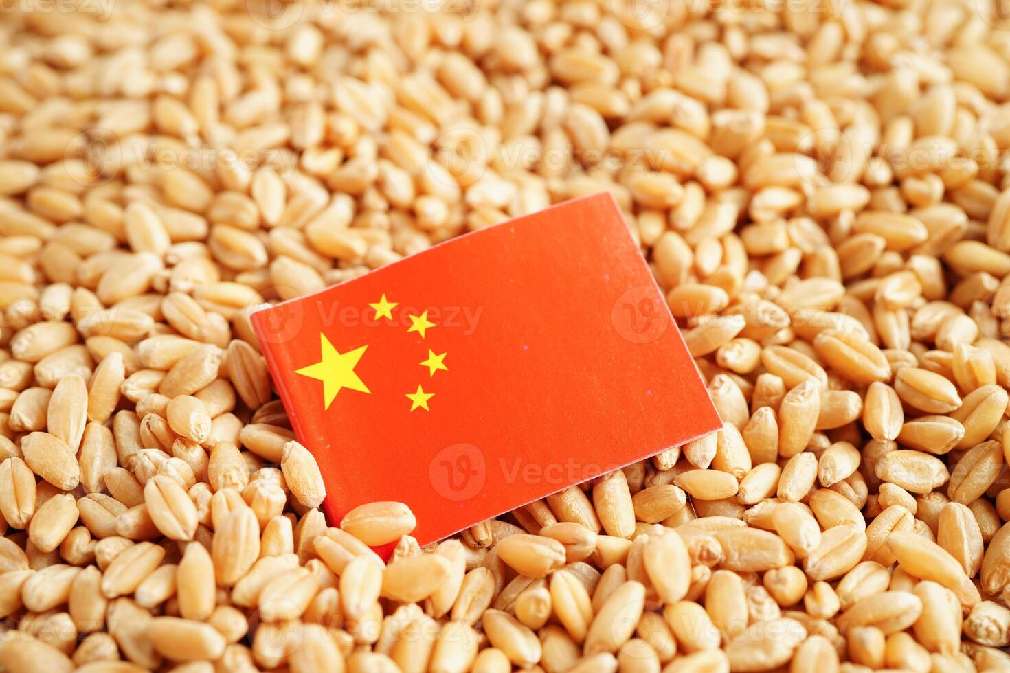 China flag on grain wheat, trade export and economy concept. photo