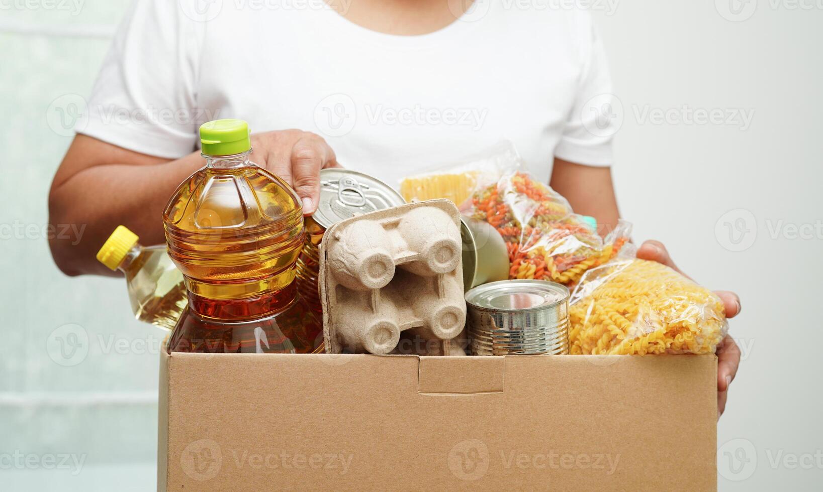 Foodstuffs in donation box for volunteer to help people. photo