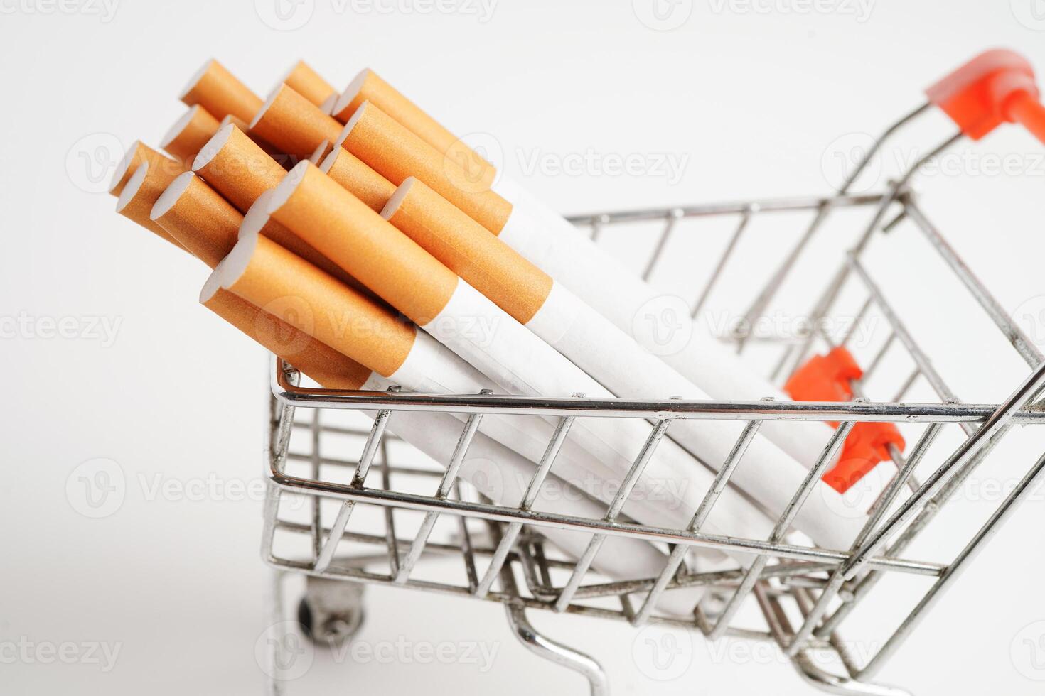 Cigarette in shopping cart, cost, trading, marketing and production, No smoking concept. photo