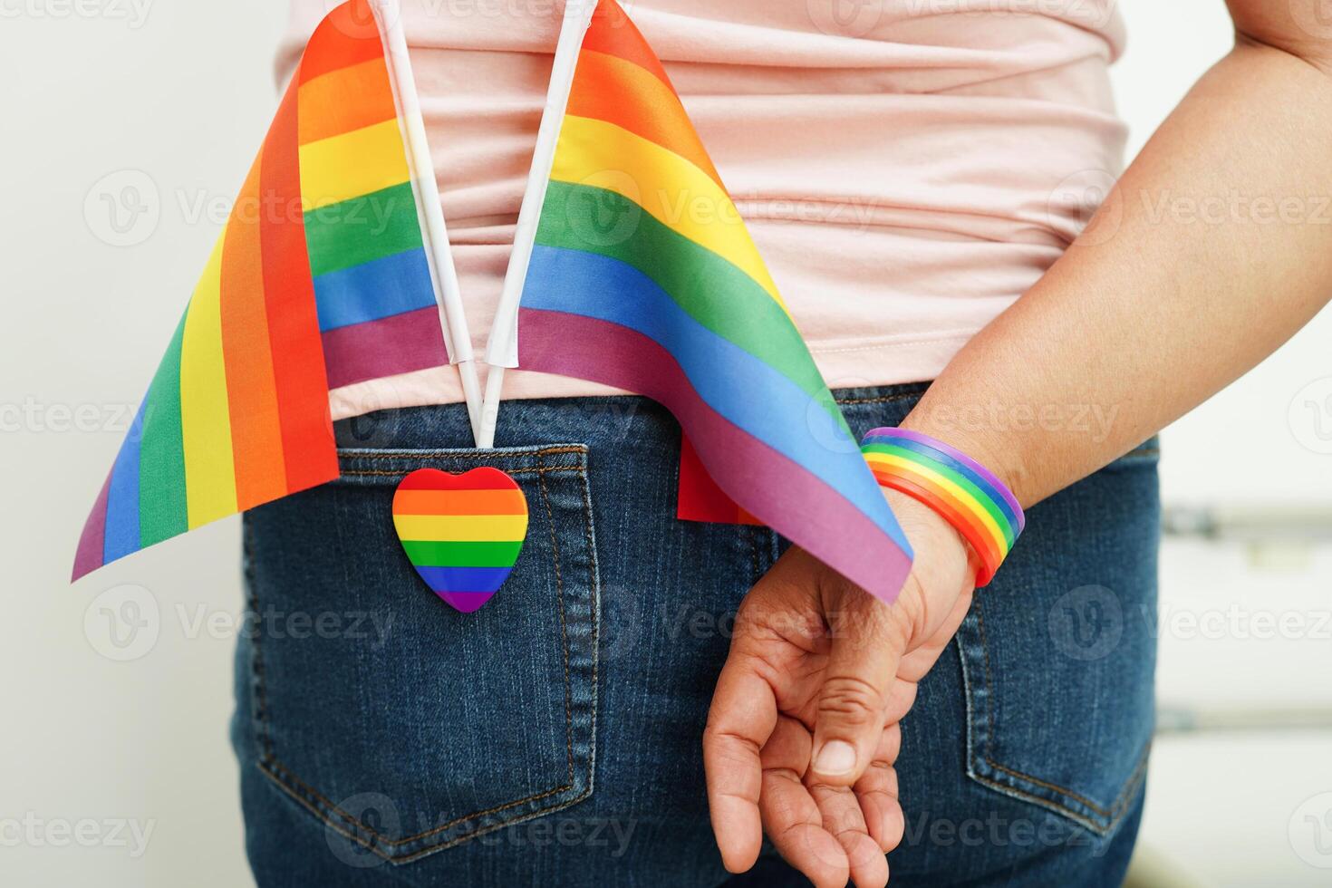 Asian woman with rainbow flag, LGBT symbol rights and gender equality, LGBT Pride Month in June. photo