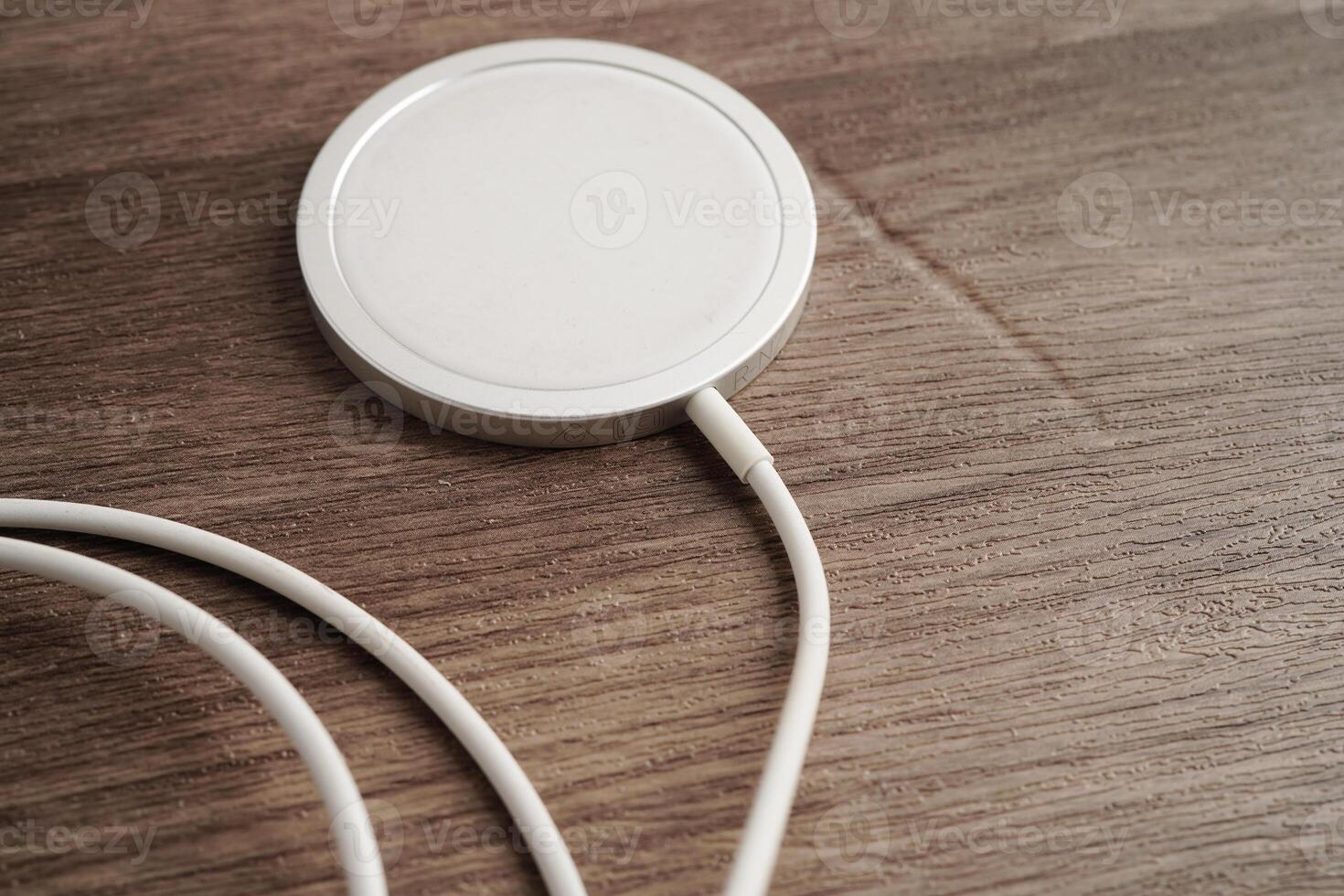 Wireless charger, magnetic charging modern equipment of mobile phone. photo