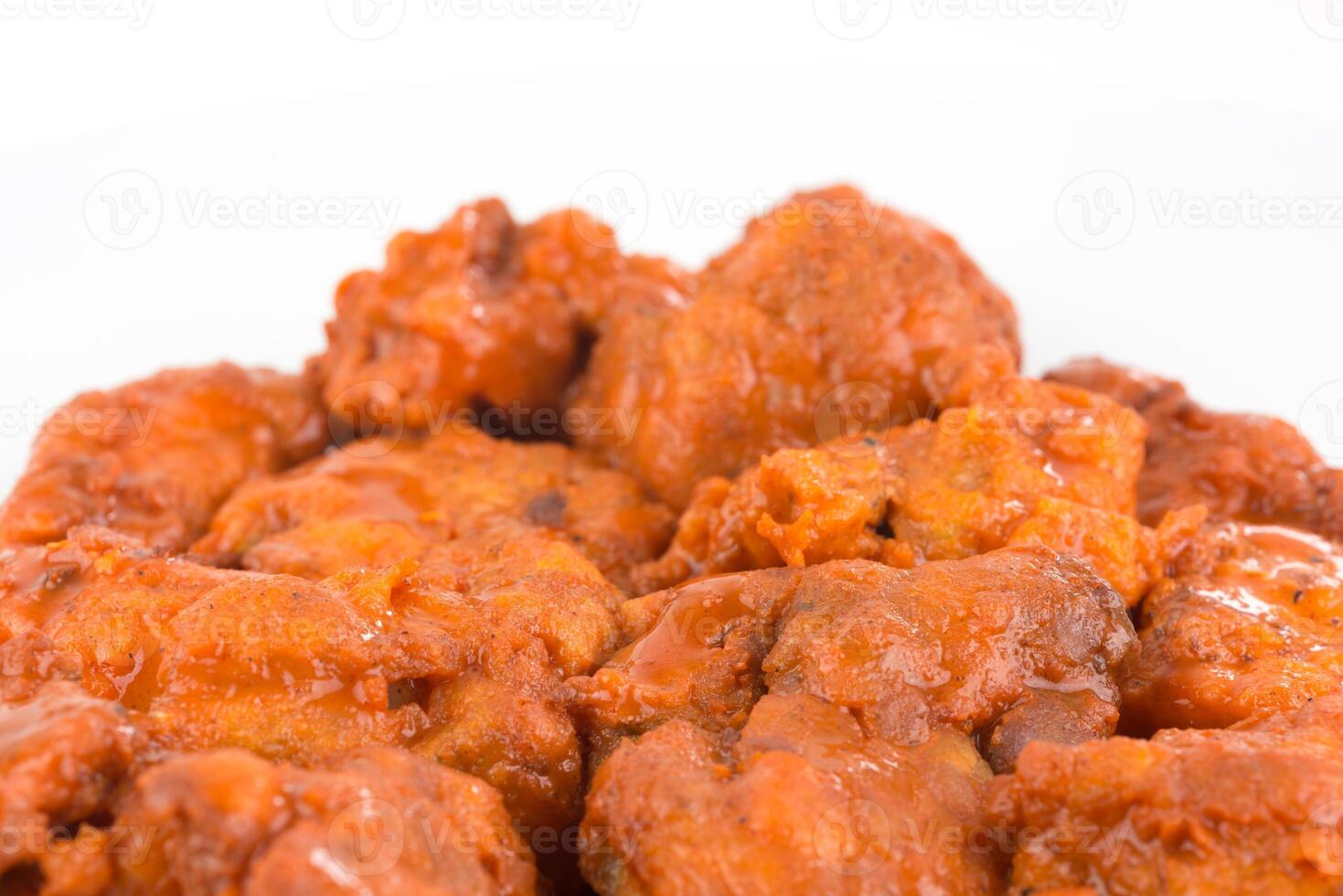 Boneless chicken wings with buffalo sauce and carrots photo